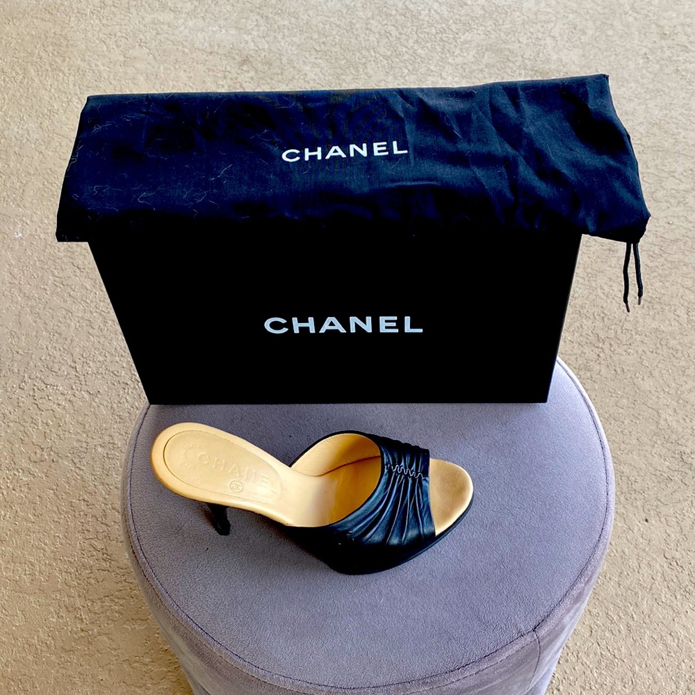 Authentic Chanel black mules with cc logo.  Heels are 3 inches.  Great condition